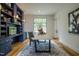 Spacious home office with built-in shelving and hardwood floors at 013 Bartley Holleman Rd # 13, New Hill, NC 27562