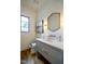 Modern powder room with a sleek vanity and hexagon mirror at 013 Bartley Holleman Rd # 13, New Hill, NC 27562