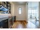 Temperature-controlled wine room with black cabinetry and glass doors at 013 Bartley Holleman Rd # 13, New Hill, NC 27562