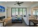 Open living room with a cozy sectional sofa and large windows at 013 Bartley Holleman Rd # 13, New Hill, NC 27562