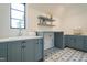 Bright laundry room with custom cabinetry at 013 Bartley Holleman Rd # 13, New Hill, NC 27562