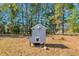 Wooden chicken coop in a wooded backyard setting at 110 Parker St, Four Oaks, NC 27524