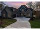 Stunning two-story home with brick exterior and a long driveway at 736 Golfers Vw # 609, Pittsboro, NC 27312