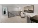 Bright and airy upper landing with a desk and seating area at 734 Apple Churn Dr, Fuquay Varina, NC 27526