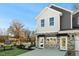 Modern two-story townhome with stone and gray siding at 734 Apple Churn Dr, Fuquay Varina, NC 27526