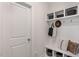 Convenient mudroom with built-in bench, cubbies, and hooks for coats and bags at 734 Apple Churn Dr, Fuquay Varina, NC 27526