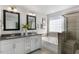 Elegant bathroom with double vanity, soaking tub, and shower at 734 Apple Churn Dr, Fuquay Varina, NC 27526