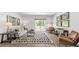 Cozy living room with hardwood floors, a neutral color palette, and plenty of natural light at 1915 Puffin Dr # 198, Haw River, NC 27258