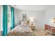 Charming bedroom with teal curtains and patterned bedding at 1915 Puffin Dr # 198, Haw River, NC 27258