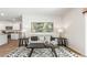 Bright living room features a comfy couch and kitchen peek at 1915 Puffin Dr # 198, Haw River, NC 27258