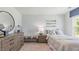 Bright bedroom with striped bedding and built-in dresser at 1915 Puffin Dr # 198, Haw River, NC 27258