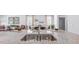 Granite kitchen island with a double sink and seating for three at 1915 Puffin Dr # 198, Haw River, NC 27258