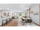 Open concept dining area with hardwood floors and modern light fixtures at 1915 Puffin Dr # 198, Haw River, NC 27258