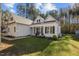 White house with front porch and rocking chairs, nicely landscaped lawn at 4321 S Greg Allen Way, Oxford, NC 27565