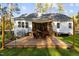 Large deck with seating area, shade sail, and built-in grill at 4321 S Greg Allen Way, Oxford, NC 27565