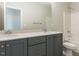 Modern bathroom with double vanity, grey cabinets, and a soaking tub at 101 Asti Ct, Clayton, NC 27527