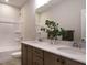 Bathroom with double vanity, quartz countertop and shower at 101 Asti Ct, Clayton, NC 27527