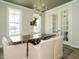 Elegant dining room with hardwood floors, a chandelier, and french doors at 101 Asti Ct, Clayton, NC 27527