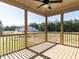 Relaxing screened porch with wood flooring and views of the backyard and neighborhood at 101 Asti Ct, Clayton, NC 27527