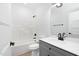 Clean bathroom with single vanity, tub, and shower at 329 & 331 Roxboro St, Haw River, NC 27258