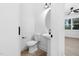 Clean bathroom with pedestal sink and large mirror at 329 & 331 Roxboro St, Haw River, NC 27258