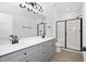Modern bathroom with double vanity, large mirror, and walk-in shower at 329 & 331 Roxboro St, Haw River, NC 27258