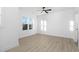 Bright bedroom with ceiling fan and wood-look floors at 329 & 331 Roxboro St, Haw River, NC 27258