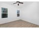 Bright bedroom with ceiling fan and wood-look flooring at 329 & 331 Roxboro St, Haw River, NC 27258