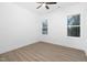 Simple bedroom with ceiling fan and two windows at 329 & 331 Roxboro St, Haw River, NC 27258