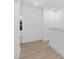 Bright hallway with light wood flooring and access to other rooms at 329 & 331 Roxboro St, Haw River, NC 27258