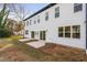 Modern two-story home with white siding, black accents, and attached garage at 329 & 331 Roxboro St, Haw River, NC 27258