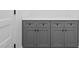 Laundry room with gray cabinets and countertop at 329 & 331 Roxboro St, Haw River, NC 27258