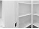 Bright white pantry with ample shelving for storage at 329 & 331 Roxboro St, Haw River, NC 27258