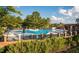 Inviting community pool with ample lounge chairs and a brick-paved deck at 370 Bellini Dr, Clayton, NC 27527