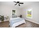 Charming bedroom with a queen bed and plenty of natural light at 617 Orange Heights Loop Rd, Hillsborough, NC 27278
