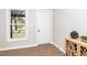 Bright entryway with white door and wood-look flooring at 617 Orange Heights Loop Rd, Hillsborough, NC 27278
