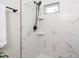 Clean bathroom with a shower and marble-tiled walls at 617 Orange Heights Loop Rd, Hillsborough, NC 27278