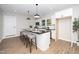 Modern kitchen with white cabinets, granite countertops, and an island at 617 Orange Heights Loop Rd, Hillsborough, NC 27278