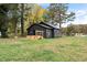 Dark gray house exterior with a spacious yard at 617 Orange Heights Loop Rd, Hillsborough, NC 27278