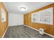 Bright dining area with wood paneled walls and a window at 603 Nellane Dr, Garner, NC 27529