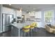 Modern kitchen with white cabinets, granite countertops, and an island at 30 Willow Bend Dr, Youngsville, NC 27596
