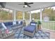 Relaxing screened porch with sectional sofa and outdoor rug at 30 Willow Bend Dr, Youngsville, NC 27596
