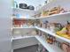 Well-stocked pantry with ample shelving for storage at 30 Willow Bend Dr, Youngsville, NC 27596