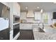 Modern kitchen with stainless steel appliances and granite countertops at 30 Willow Bend Dr, Youngsville, NC 27596