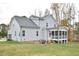 Two-story house with gray siding, screened porch, and backyard at 30 Willow Bend Dr, Youngsville, NC 27596