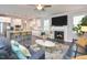 Open living room featuring a fireplace and kitchen with island at 30 Willow Bend Dr, Youngsville, NC 27596