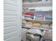 Well-organized linen closet with ample shelving for storage at 30 Willow Bend Dr, Youngsville, NC 27596