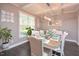 Elegant dining room with a large table and decorative lighting at 30 Willow Bend Dr, Youngsville, NC 27596
