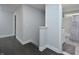 Upstairs hall with dark hardwood floors and bathroom access at 30 Willow Bend Dr, Youngsville, NC 27596