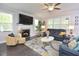 Cozy living room with fireplace, hardwood floors, and comfortable seating at 30 Willow Bend Dr, Youngsville, NC 27596